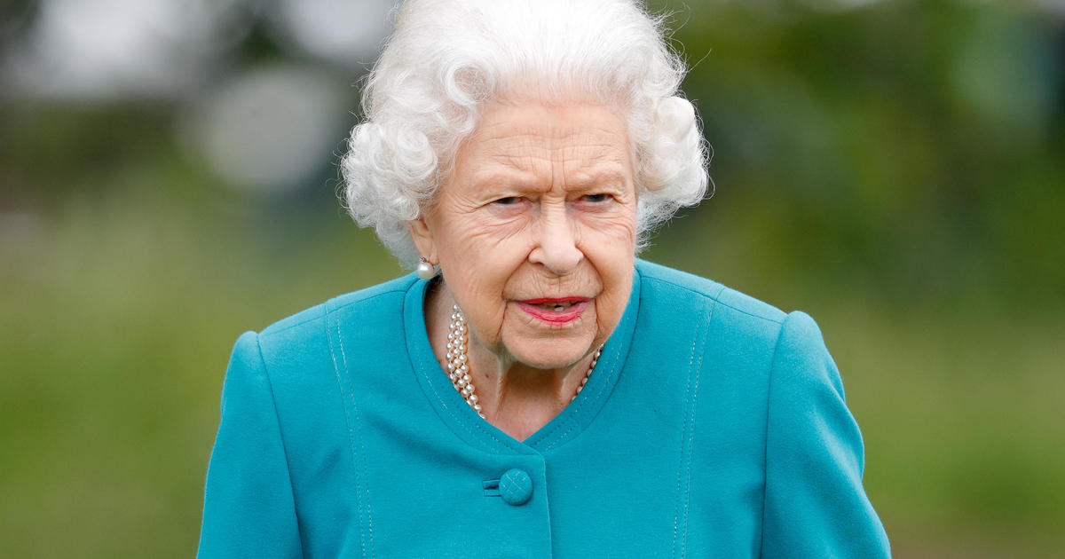 Queen Elizabeth spends night in hospital after canceling Northern Ireland trip - CBS News